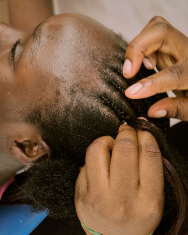 A close-up of fresh box-braid partings