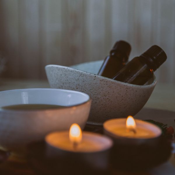 Aromatherapy candles and oils in a treatment room