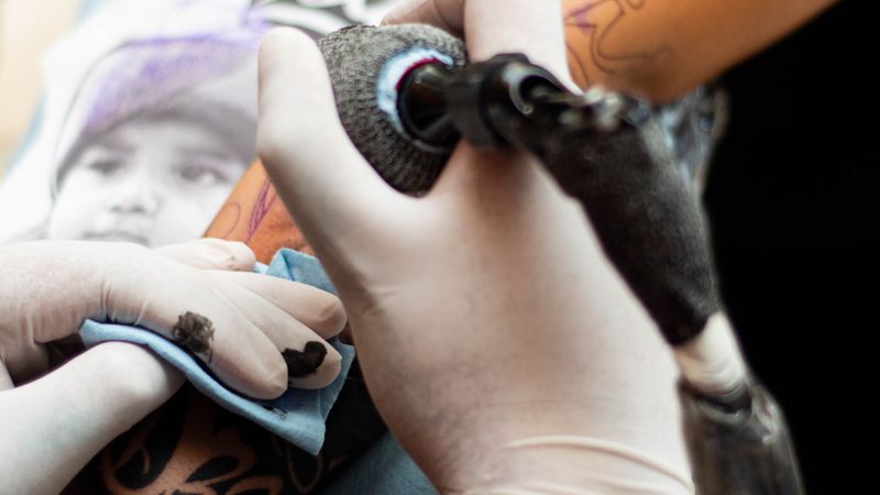 Close-up of healed black-and-grey realism tattoo work