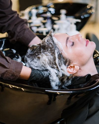 A bright, plant-lined salon interior