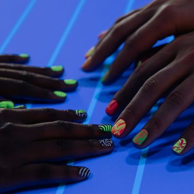 Hands with freshly painted nails